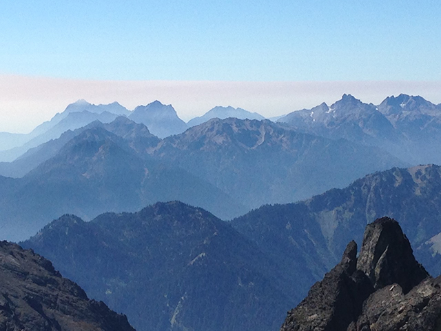 Looking south from high up in the Eastern portion of Olympic National Park, wildfire smoke begins making its way into the park. (Photo: Dahr Jamail)